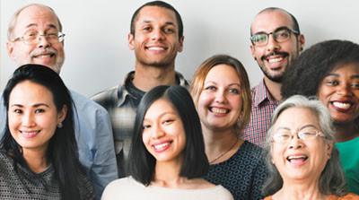 A diverse group of happy, smiling people.